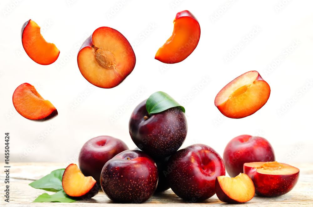 plums with flying slices plums with flying slices