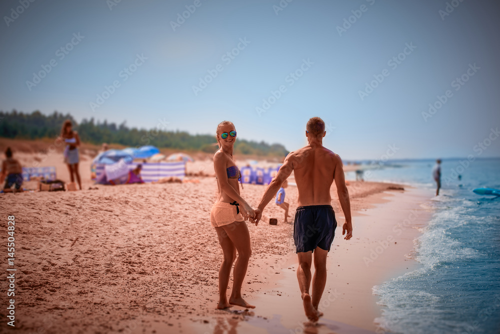 Athletic couple over the sea
