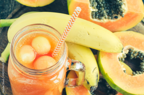 Fototapeta Naklejka Na Ścianę i Meble -  Papaya and banana smoothie in glass jar