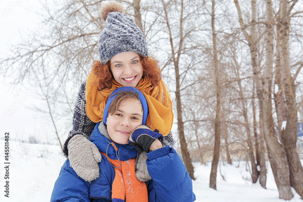 Fototapeta premium Mother with son playing in winter park