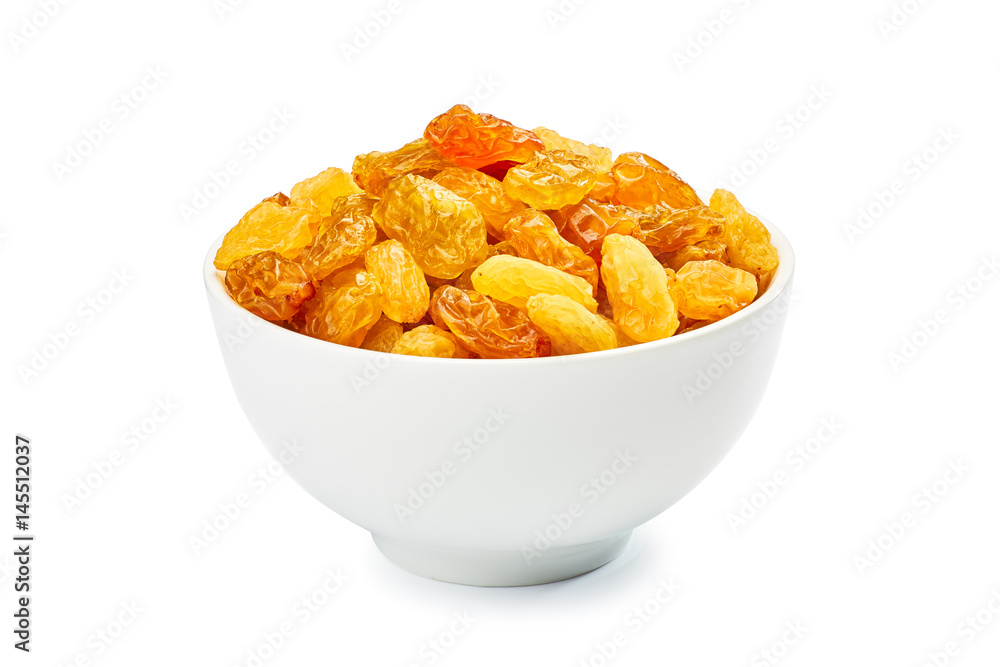 Bowl of golden raisins on white