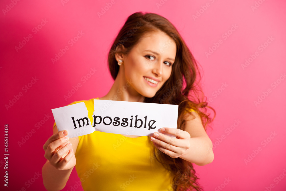 Woman tearing a paper with impossible script Woman tearing a paper with impossible script