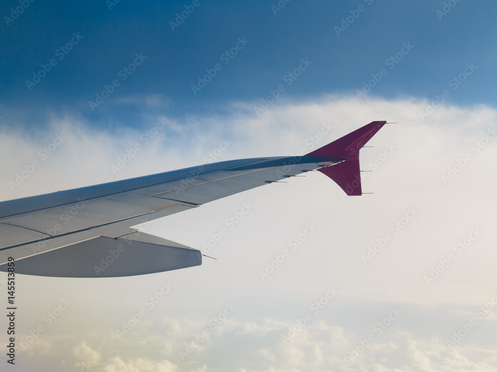 Fototapeta premium Beautiful white clouds and blue sky from plane