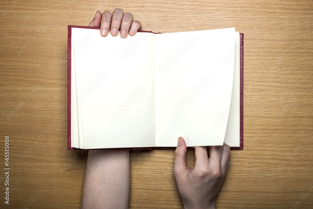 woman hand hold a letter with envelope on the wood table. woman hand hold a letter with envelope on the wood table.