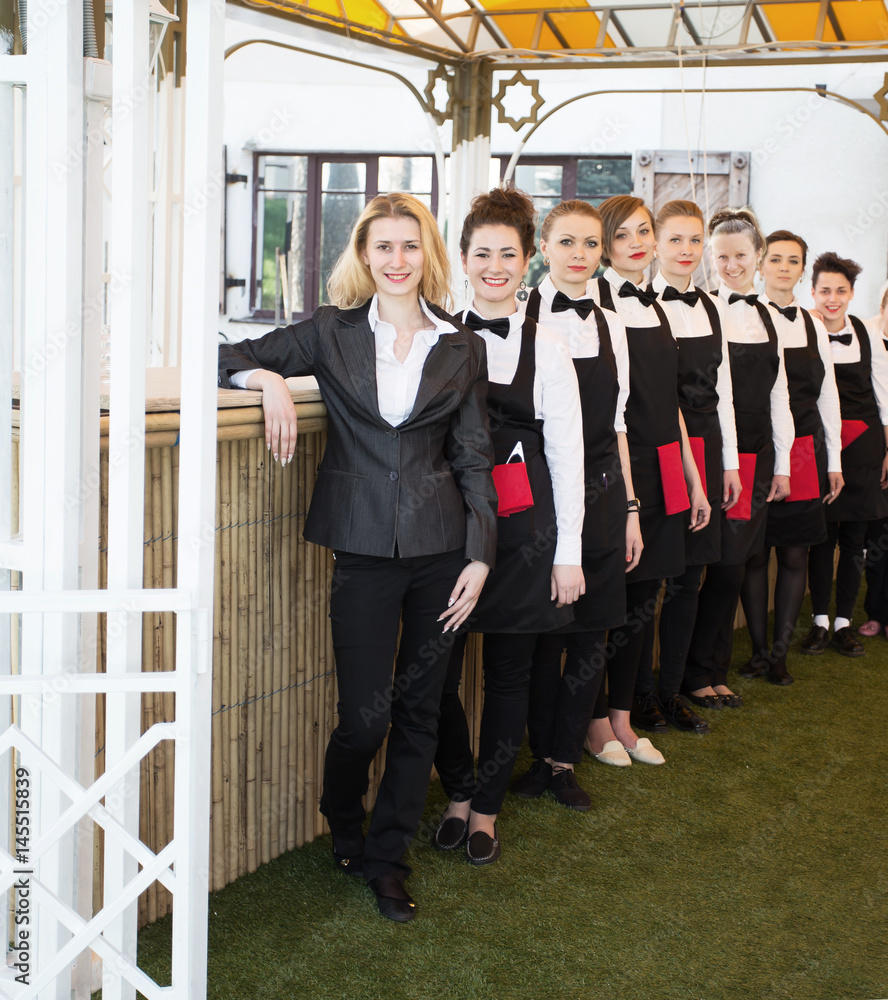 group of waiters at a prestigious restaurant standing in the col group of waiters at a prestigious restaurant standing in the col