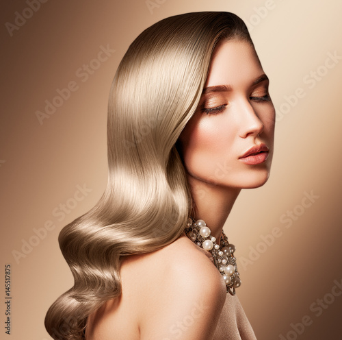 Fotografie Beautiful model girl with long wavy and shiny hair