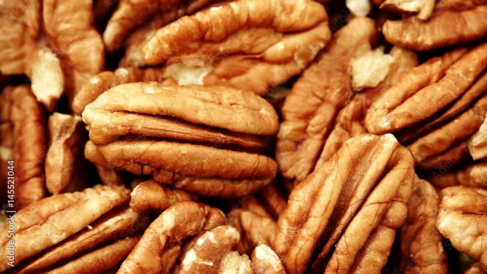 Food background. Pecan nuts close up. Dieting concept. Dolly slider shot 4K ProRes HQ codec Food background. Pecan nuts close up. Dieting concept. Dolly slider shot 4K ProRes HQ codec