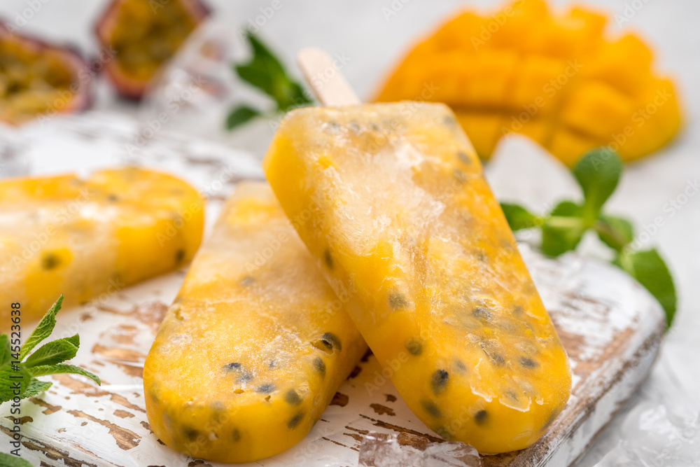 Homemade frozen popsicles with fresh mango and passion fruit Homemade frozen popsicles with fresh mango and passion fruit