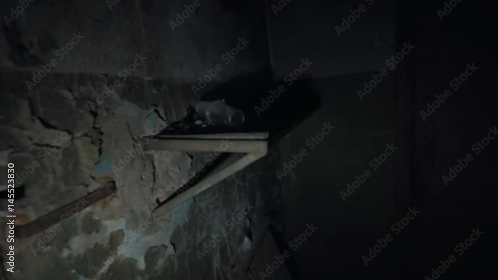 Point of view man with flashligh look arond in dark empty room inside scary abandoned building, kicks wooden board post apocalyptic war scavenger stalker, lots of trash Point of view man with flashligh look arond in dark empty room inside scary abandoned building, kicks wooden board post apocalyptic war scavenger stalker, lots of trash