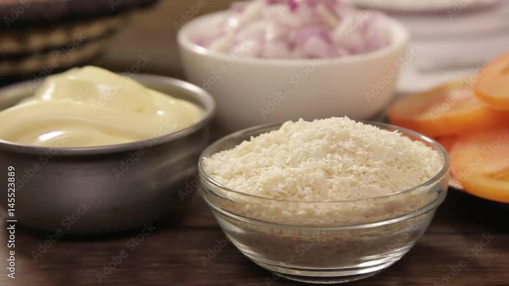 Beef Patty Ingredients - Bread Crums And Mayonesse In A White Bowl - Slider - Moving Towards Beef Patty Ingredients - Bread Crums And Mayonesse In A White Bowl - Slider - Moving Towards