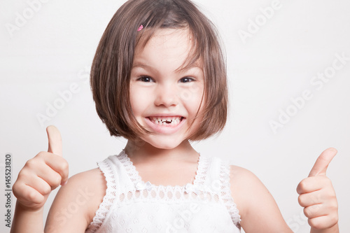 The child dropped the first milk tooth