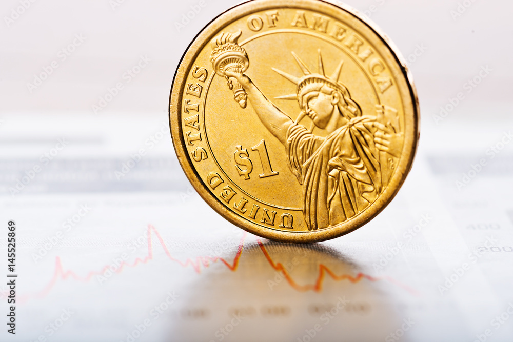 one-dollar-coin-on-fluctuating-graph-rate-of-the-us-dollar-shallow
