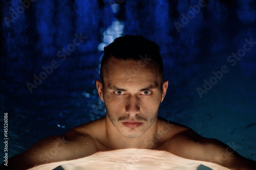 Man swimming in the pool 