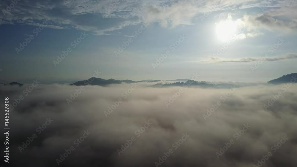 Aerial flight over clouds, mountains and countryside Aerial flight over clouds, mountains and countryside