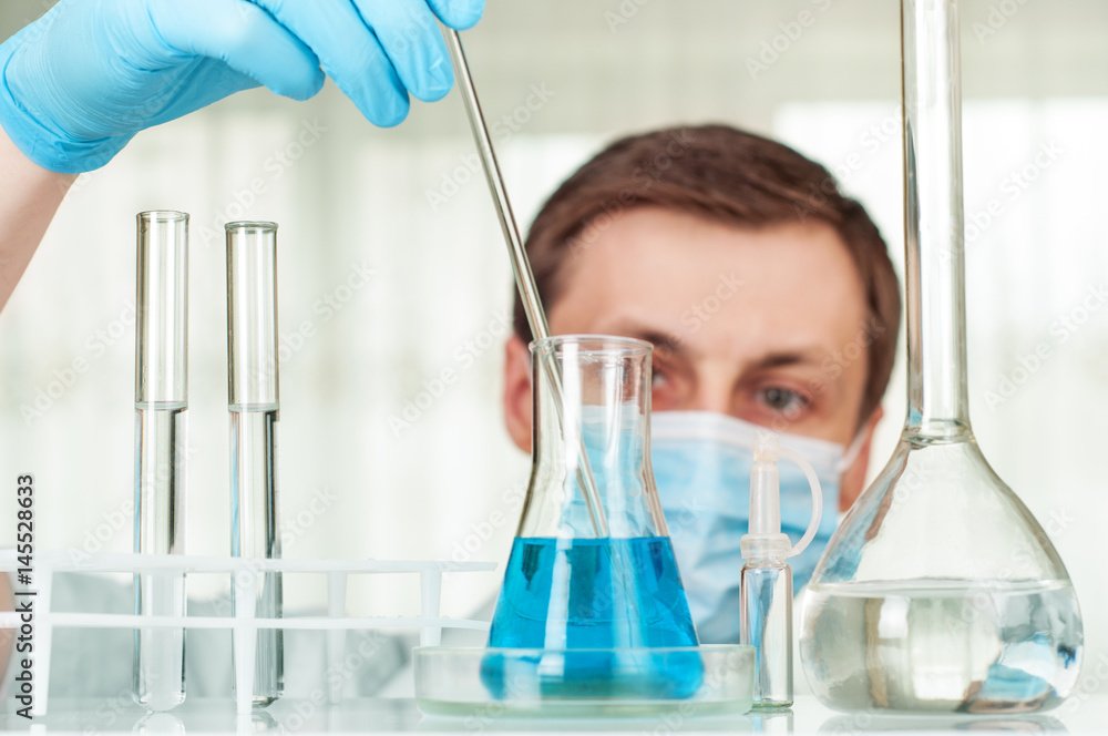 Laboratory scientist working at lab with test tubes Laboratory scientist working at lab with test tubes