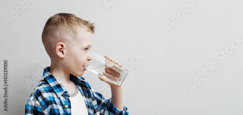 child drinks pure water