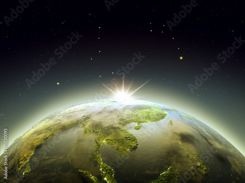 Fototapeta Naklejka Na Ścianę i Meble -  Sunrise above Indochina from space