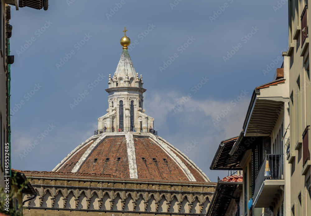 Brunelleschi's famous Dome appears among the buildings in the historic center of Florence, Italy, on a sunny day