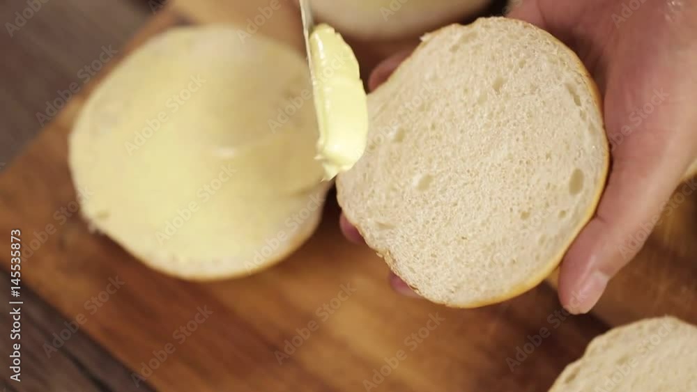 Buns - Putting Butter On Round Cut Buns - Close Up - Top Angle 5 Buns - Putting Butter On Round Cut Buns - Close Up - Top Angle 5