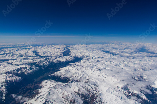 View over the alps from high altitude in spring