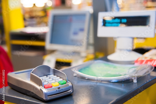 Картината върху платно Cash desk with payment terminal in supermarket