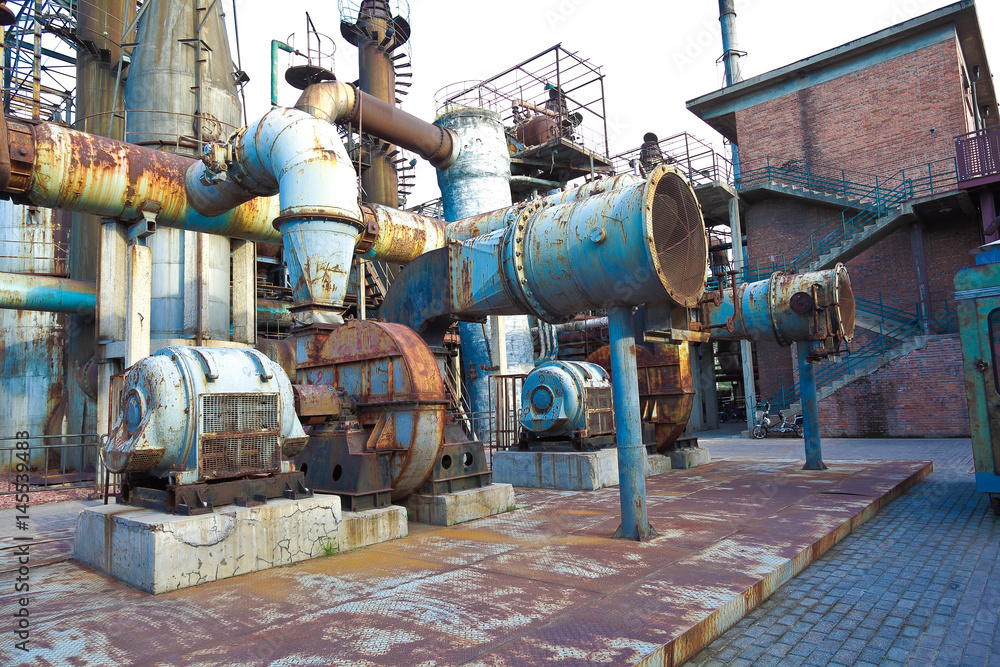 Naklejka premium Old abandoned closed steel steelworks pipelines