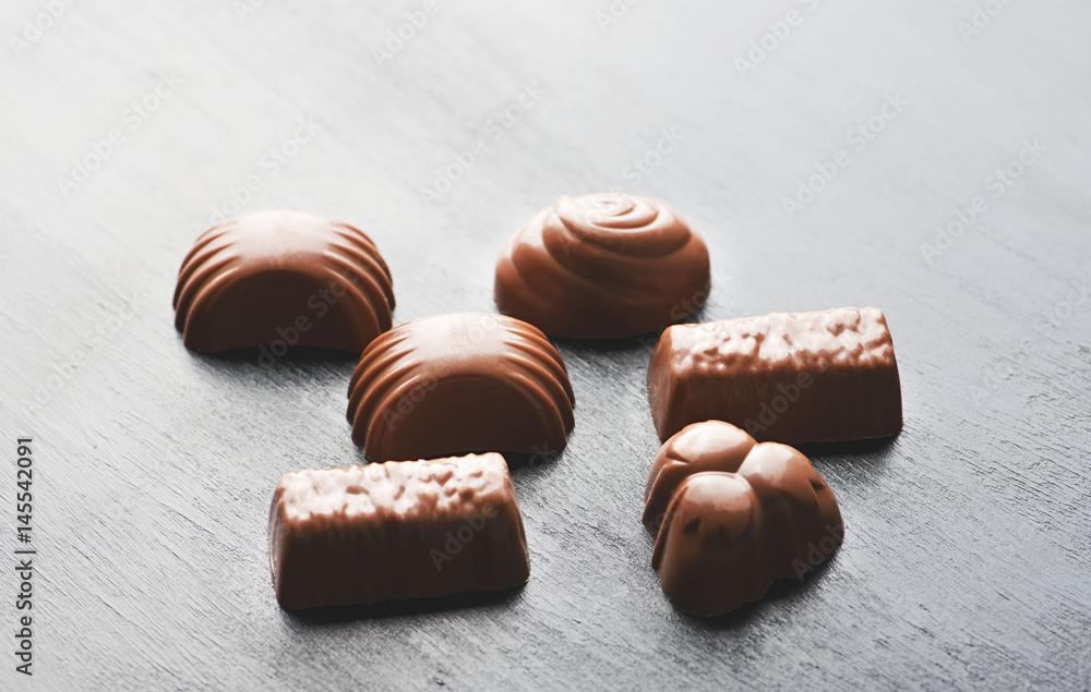 Chocolates on black background. Food. Chocolates on black background. Food.