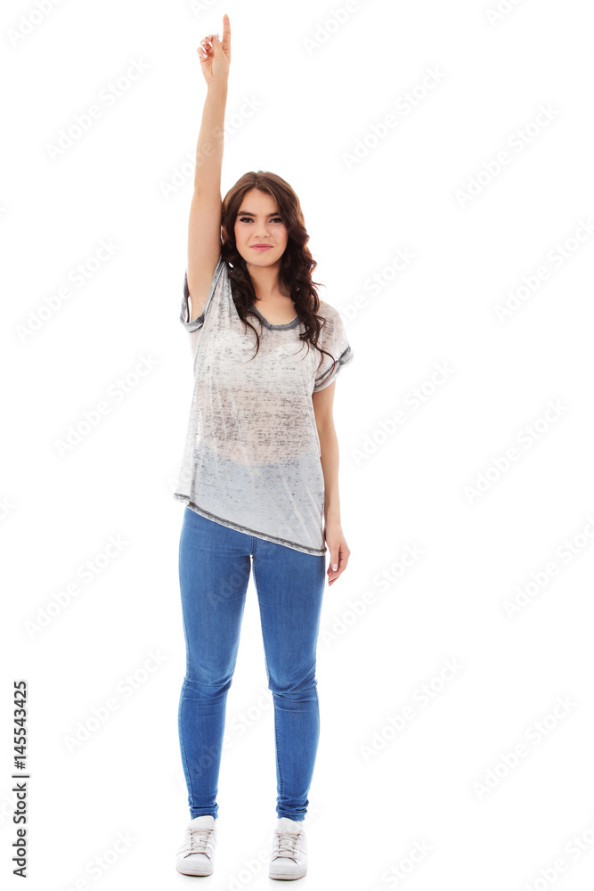 Portrait of a smiling young woman pointing up. Portrait of a smiling young woman pointing up.