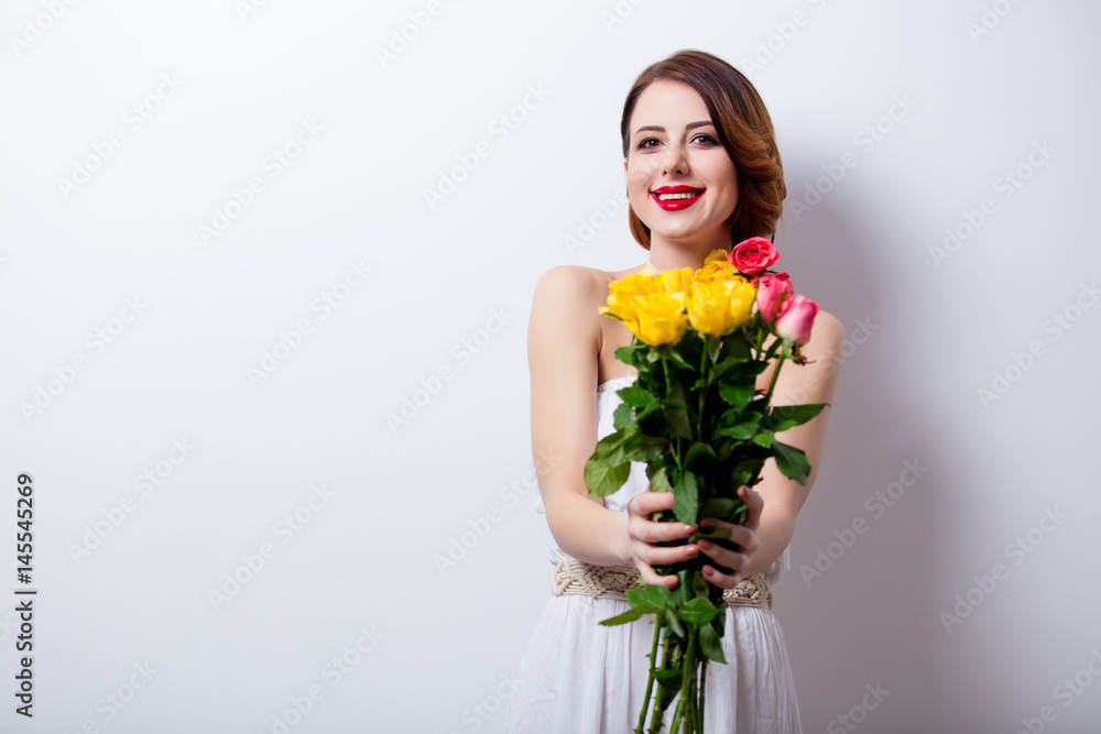 portrait of beautiful young woman with bouquet of roses on the wonderful studio background portrait of beautiful young woman with bouquet of roses on the wonderful studio background
