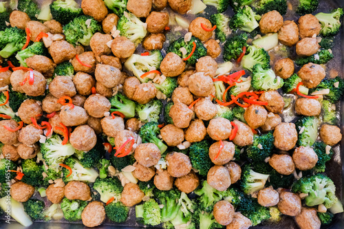 Stir-fried broccoli with shrimp balls on silver tray