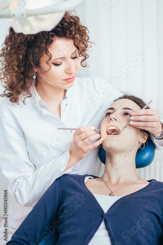 Female dentist working in her dentist office.