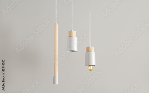 Hanging lamps with wooden parts