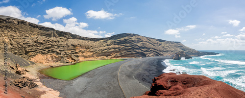 Panorama of Laguna Verde, a green lake near the village of El Golfo in Lanzarote, Canary islands, Spain photo