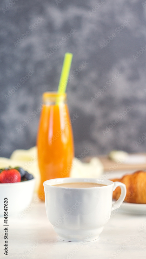 coffee, croissant and orange juice. Breakfast on white background coffee, croissant and orange juice. Breakfast on white background