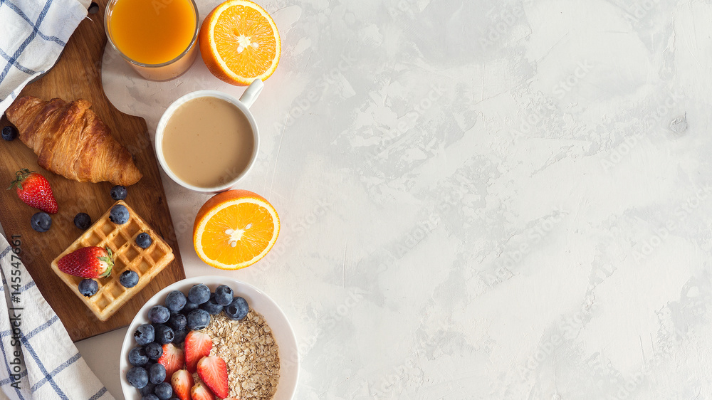 Cup of coffee and croissants on white background. Morning breakfast. Copy space Cup of coffee and croissants on white background. Morning breakfast. Copy space