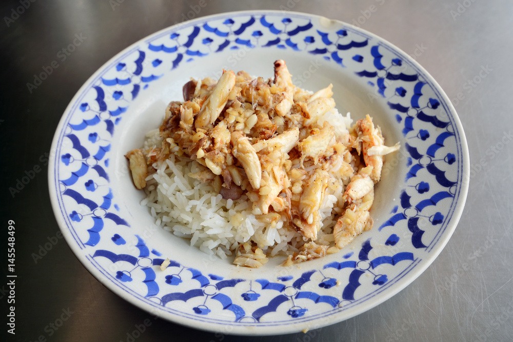 Crab meat fried with garlic top on rice in Thai style cuisine food Crab meat fried with garlic top on rice in Thai style cuisine food
