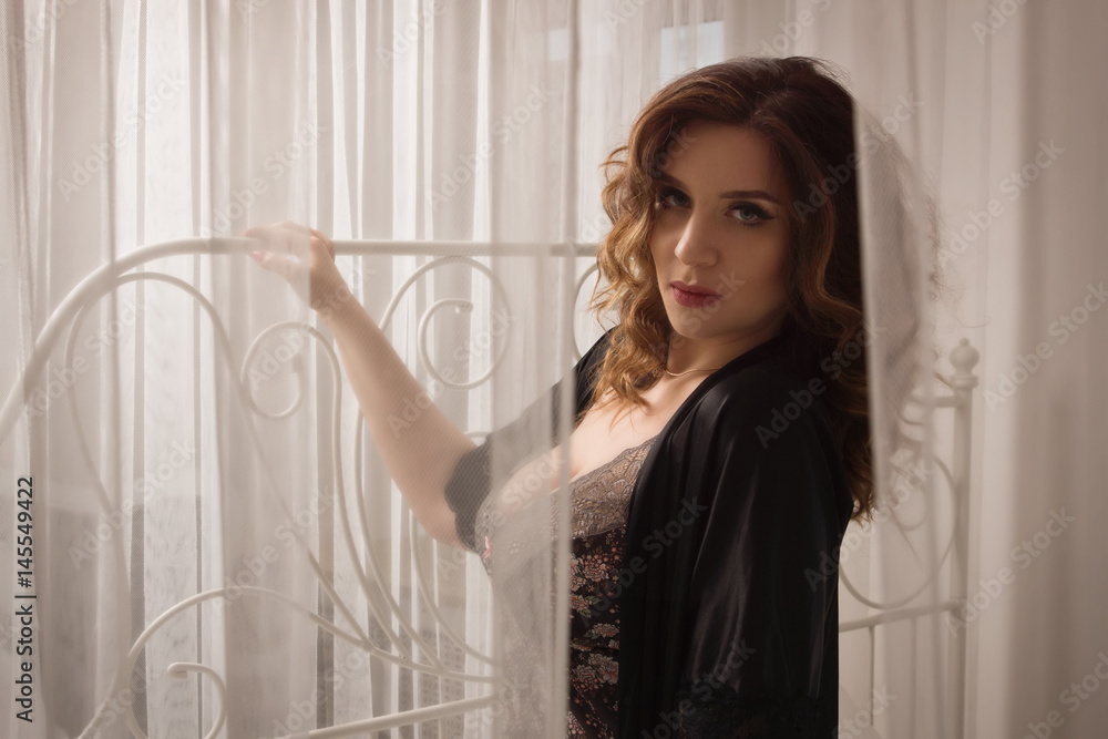 Sexual emotional attractive woman posing in a boudoir Sexual emotional attractive woman posing in a boudoir