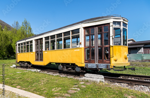 Yellow vintage tram on tracks 