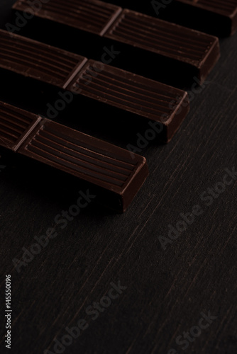 Close-up of dark chocolate bar tiles