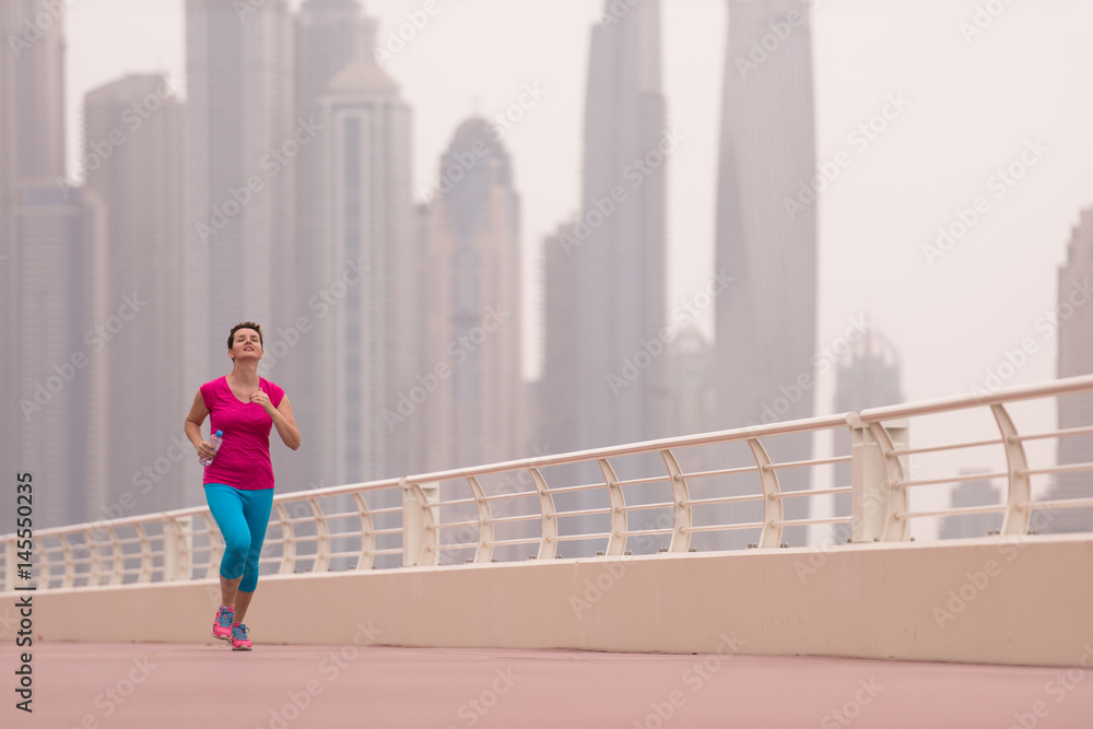 woman running on the promenade woman running on the promenade