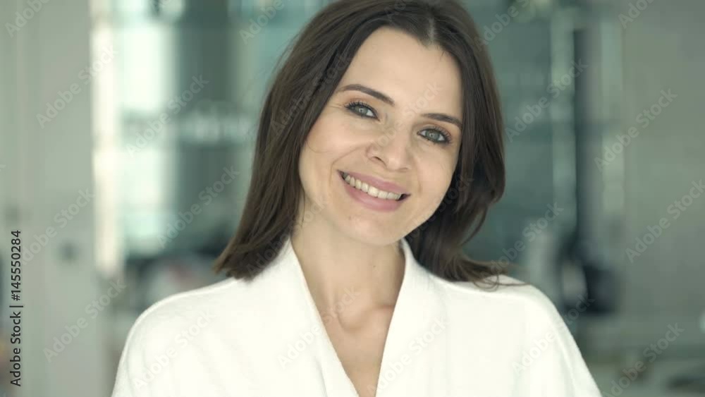 Portrait of happy, pretty woman in bathrobe at home
Portrait of happy, pretty woman in bathrobe at home