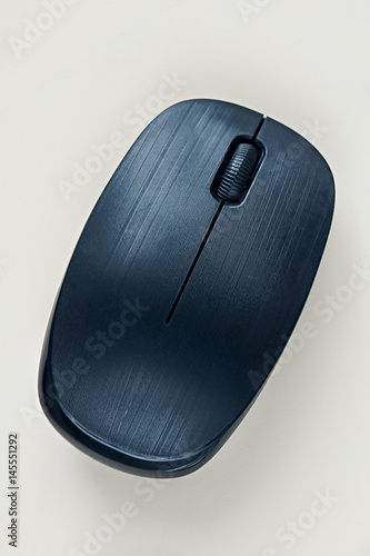 Black wireless mouse on white background