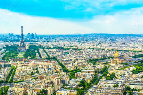 Panorama Eiffel Tower in Paris from a height on a sunny day with a blue sky. A view of Paris from a bird's-eye view. © HappyRichStudio