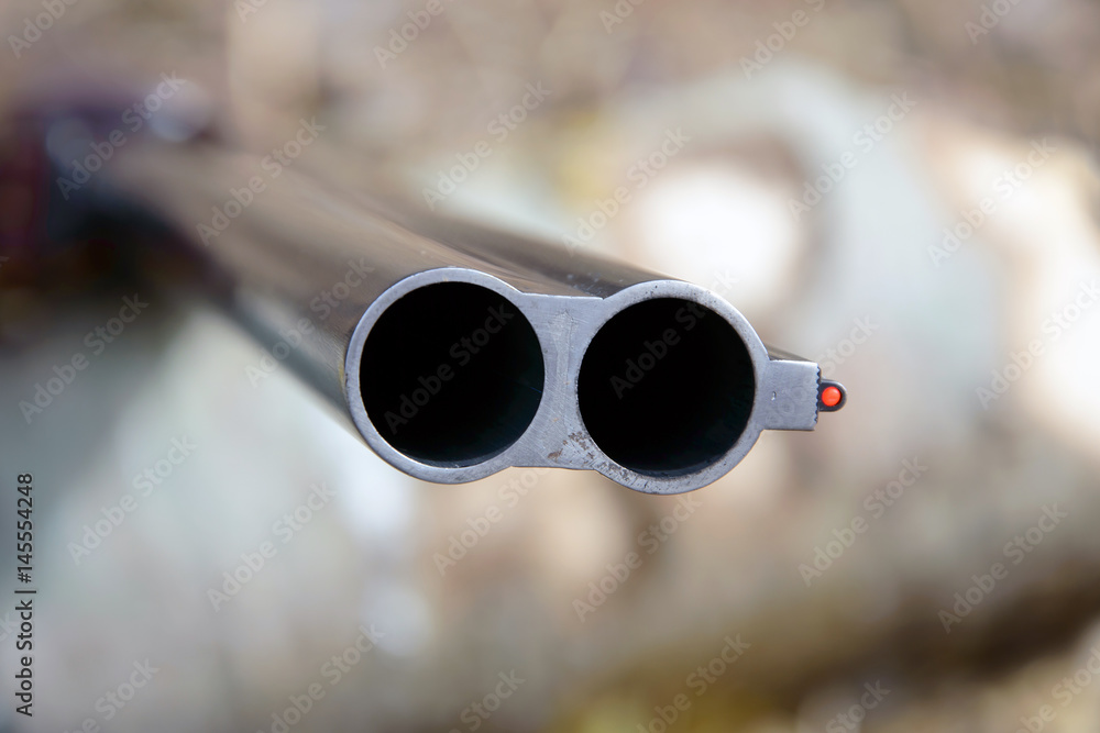 Muzzle of doublebarreled shotguns. Shotgun pointed at me macro