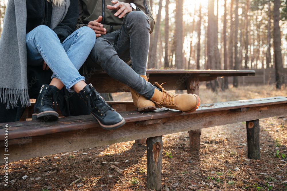 Cropped image of loving couple sitting outdoors