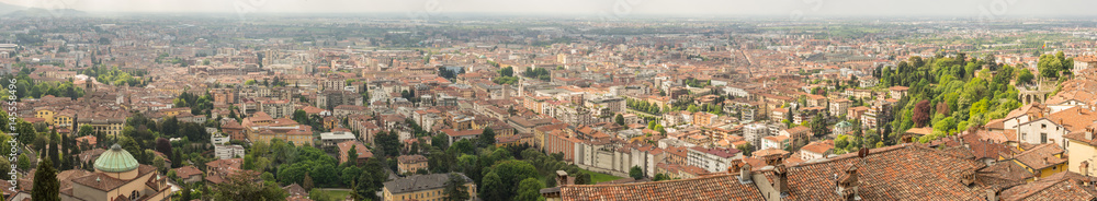 Bergamo, Italy. Landscape on the old city (upper town), the city center, the group of old towers and the new city. Shot from the old fortress.