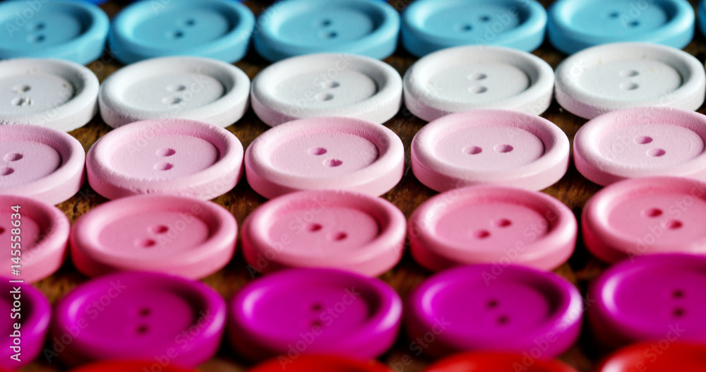 roundup of buttons colorful couture, buttons of all high-fashion colors to sew on clothing. concept of color, fashion, dressmaking, sewing, tailor. roundup of buttons colorful couture, buttons of all high-fashion colors to sew on clothing. concept of color, fashion, dressmaking, sewing, tailor.