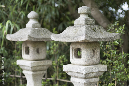 MATSUSHIMA, JAPAN - JULY 8, 2015 : Buddhist statue located along the entrance to the Zuiganji Temple in Matsushima. The area is considered one of the Three Most Scenic Spots in Miyagi District , Japan photo