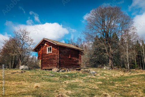 Old red log cabin