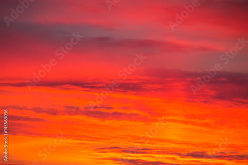 Fiery orange sunrise sky © olyasolodenko